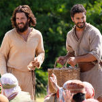 Jesus and Simon the Zealot feed the hungry crowd.