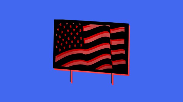 An American flag campaign sign on a blue background