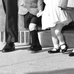 A vintage photo of a family leaving church together.