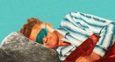 A man sleeping with a rock for a pillow