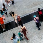 Flight passengers walking in the Hong Kong International Airport.
