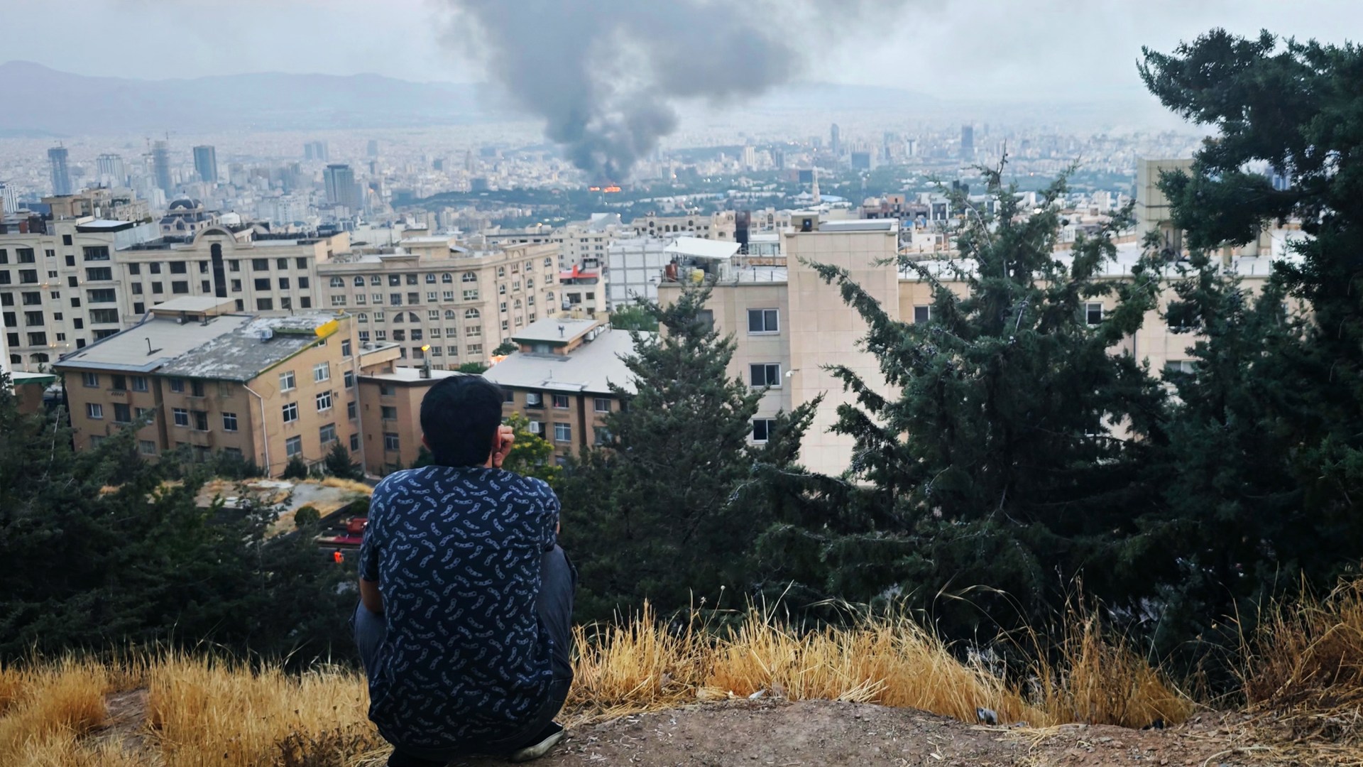 Smoke rises after a reported Israeli strike on a building in Tehran, Iran on June 16, 2025.