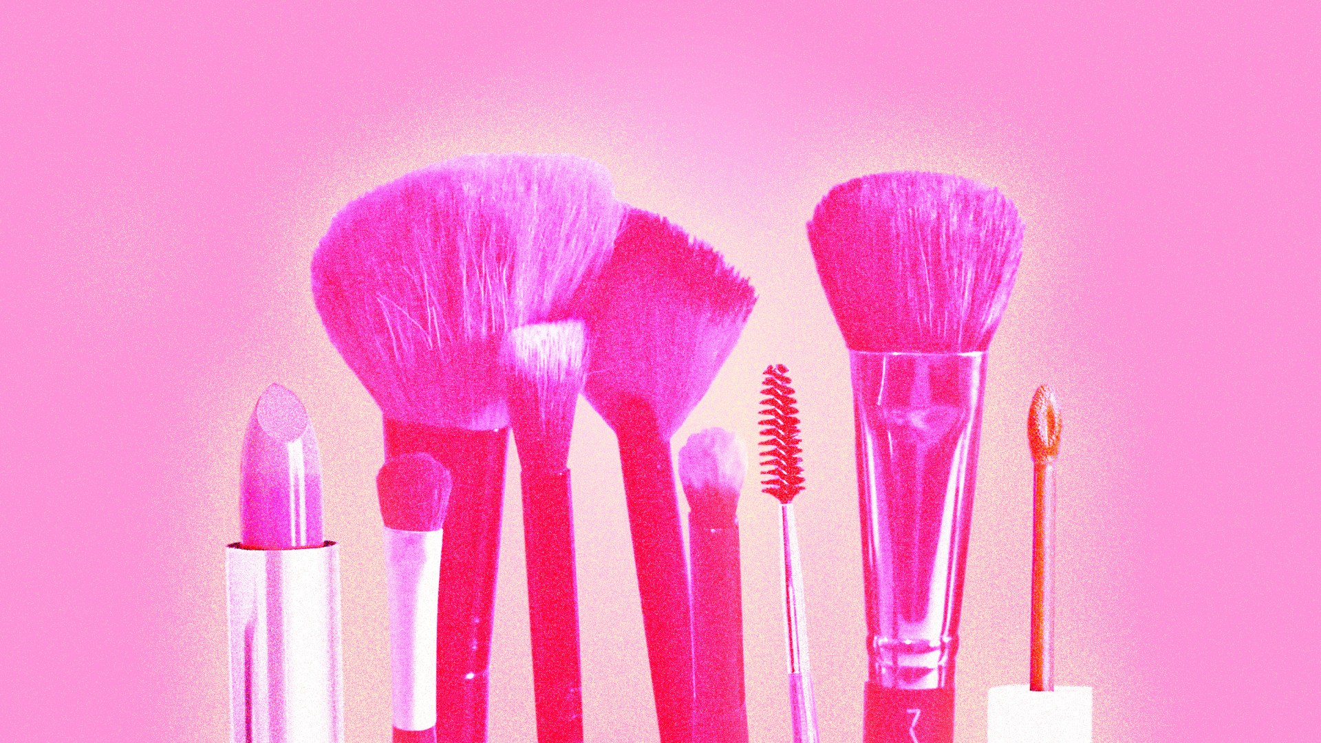 Glowing makeup brushes and lipstick.
