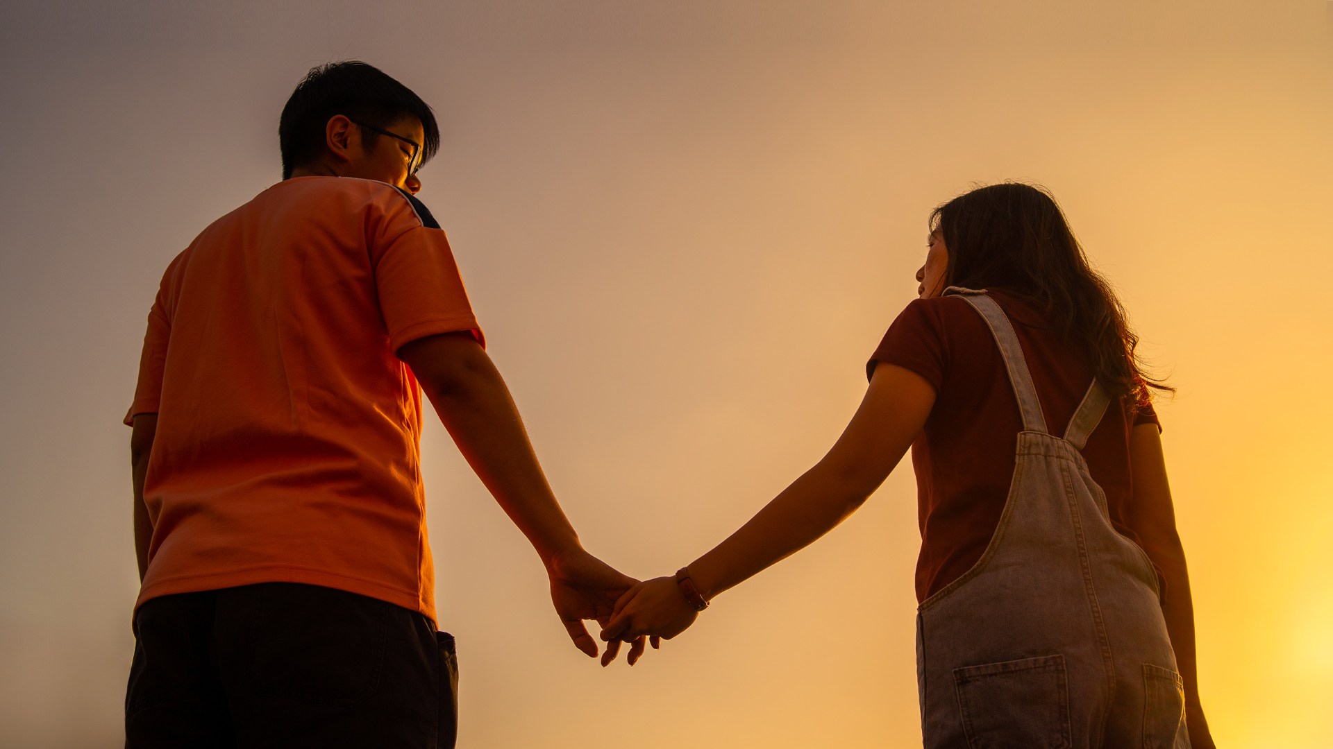 A Chinese couple holding hands.